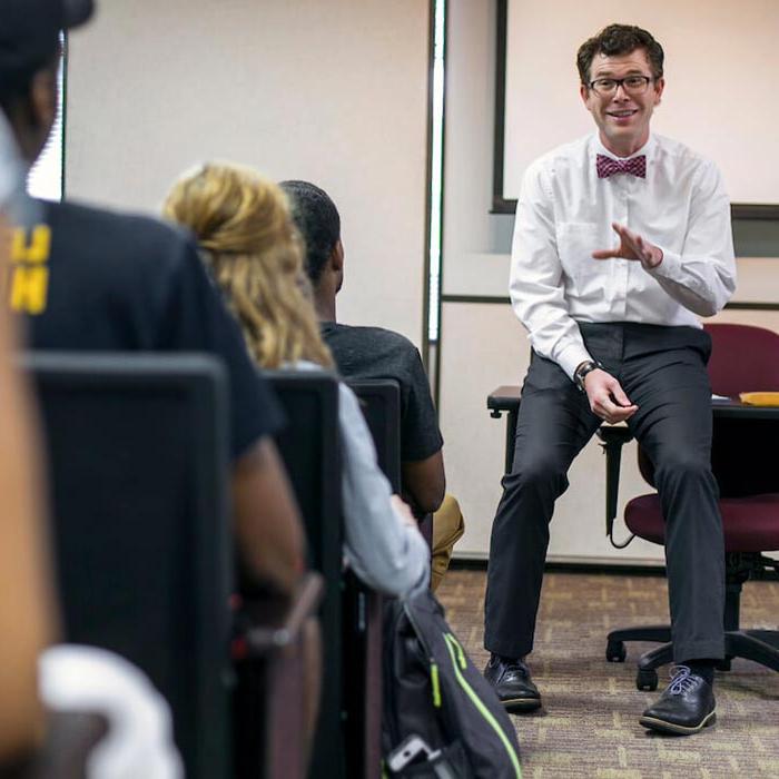 Professor talking to students from front of classroom